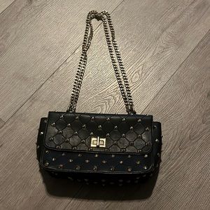 Shoulder purse. Black. With gold straps. Looks expensive. Good storage inside